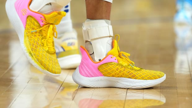 Golden State Warriors point guard Stephen Curry wearing the Sesame Street x Curry Flow 9 'Street Pack - Play Big'.